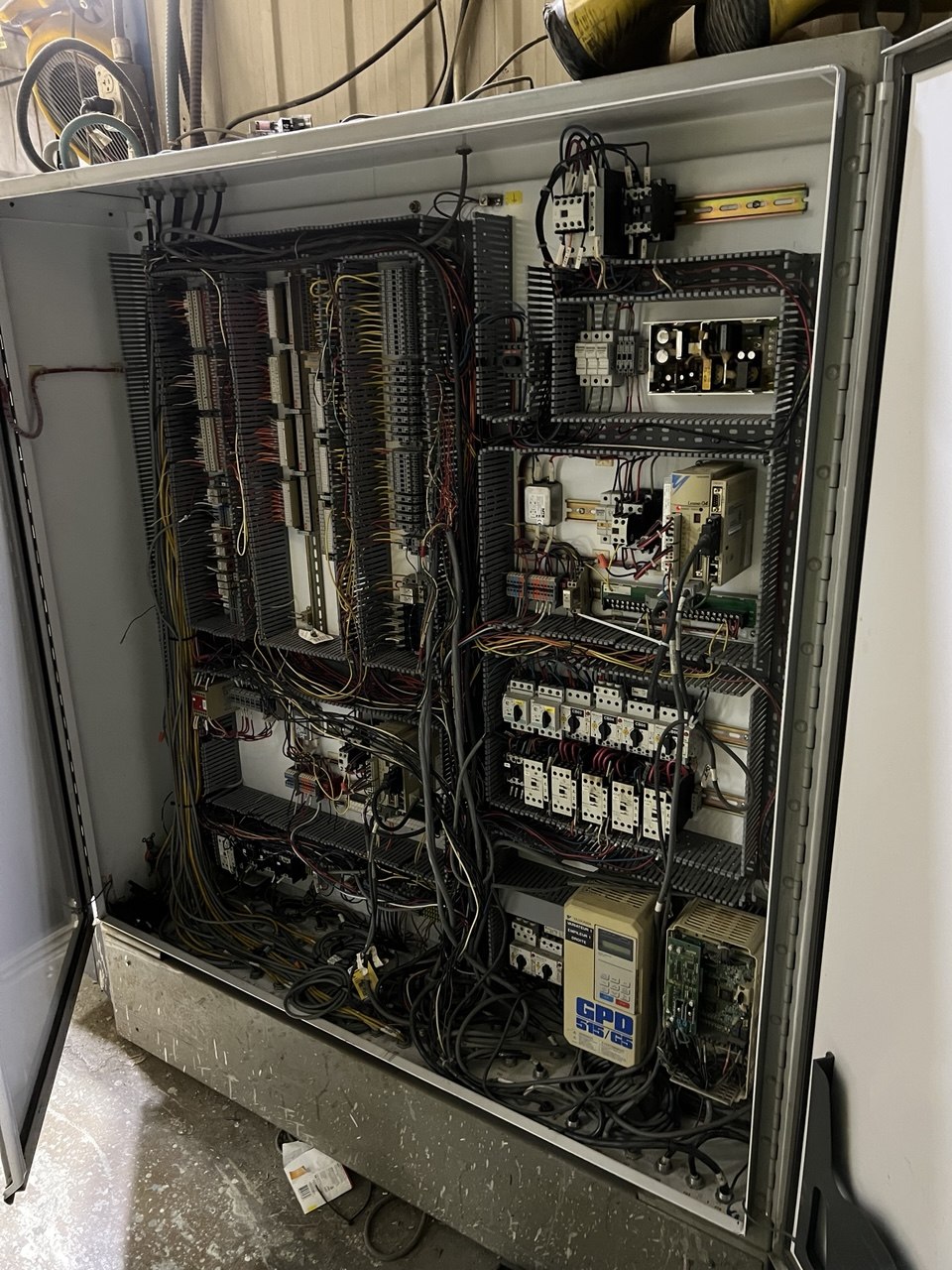 Complex controls cabinet — VFDs, PLC, terminal strips