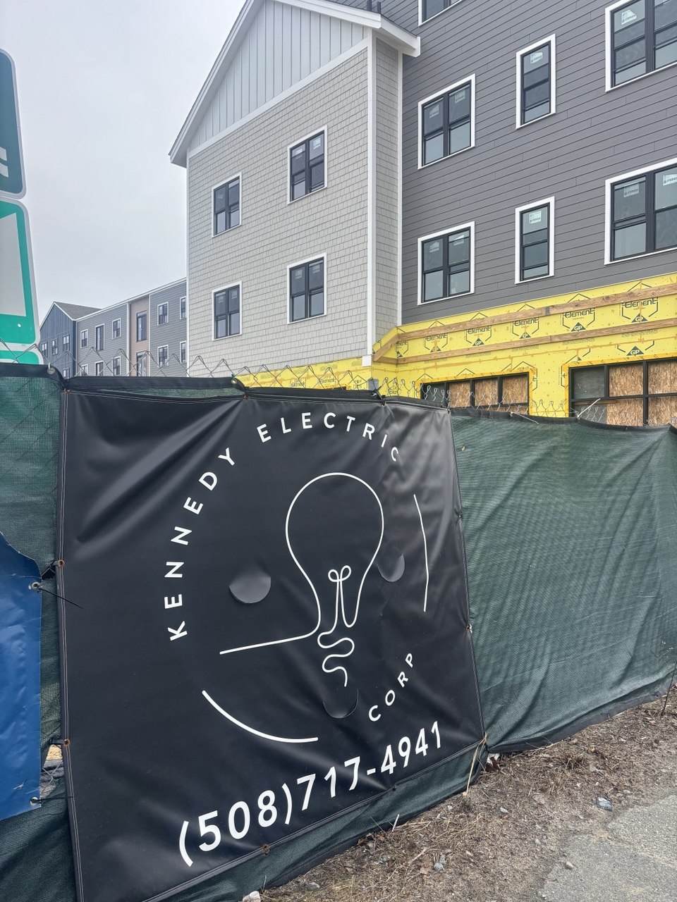 Kennedy Electric banner at Hyannis Lofts construction site