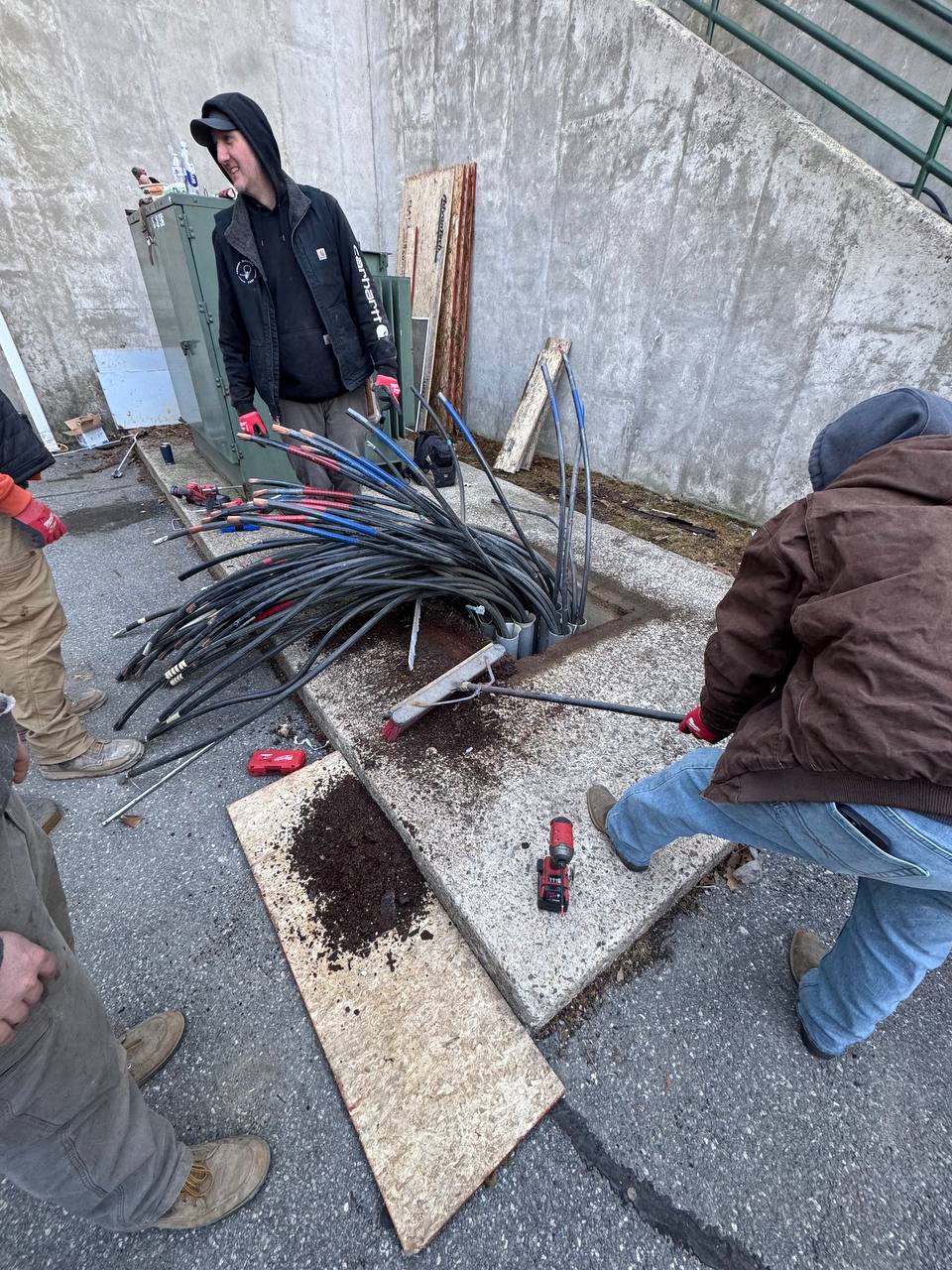 KEC crew cutting and prepping large conductors at pad vault