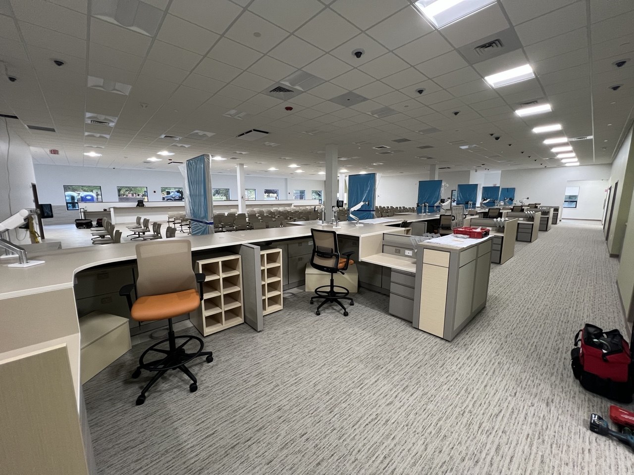 Completed office floor — LED troffers and security cameras